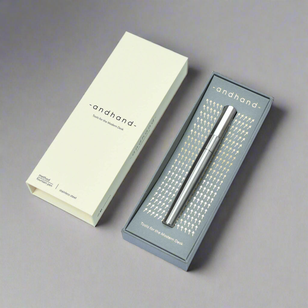 Solid stainless steel method fountain pen in premium card presentation box featuring gold foiled inlay.