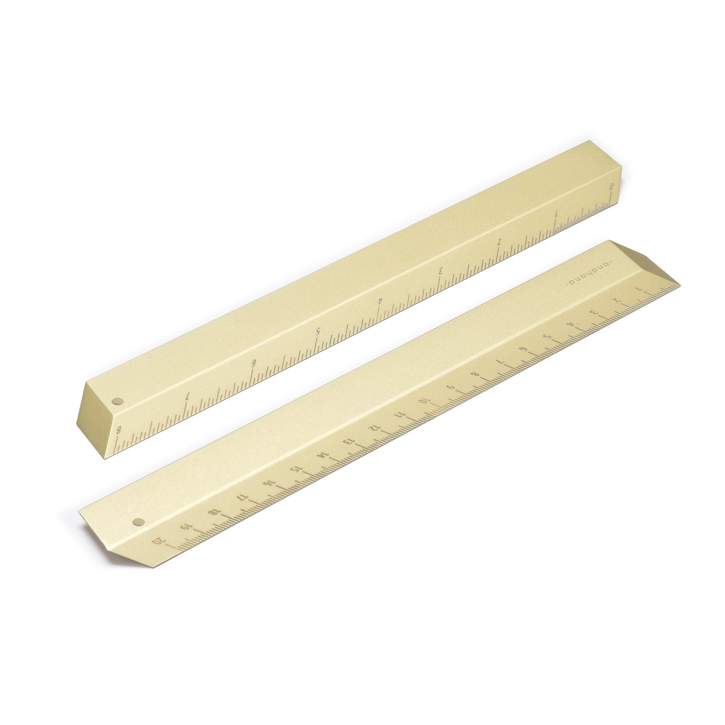 The illusion ruler by Andhand, modern and striking design. Its angled profile allows for extremely accurate mark making and measurements in both metric and imperial. Seen here in gold lustre satin anodized finish.