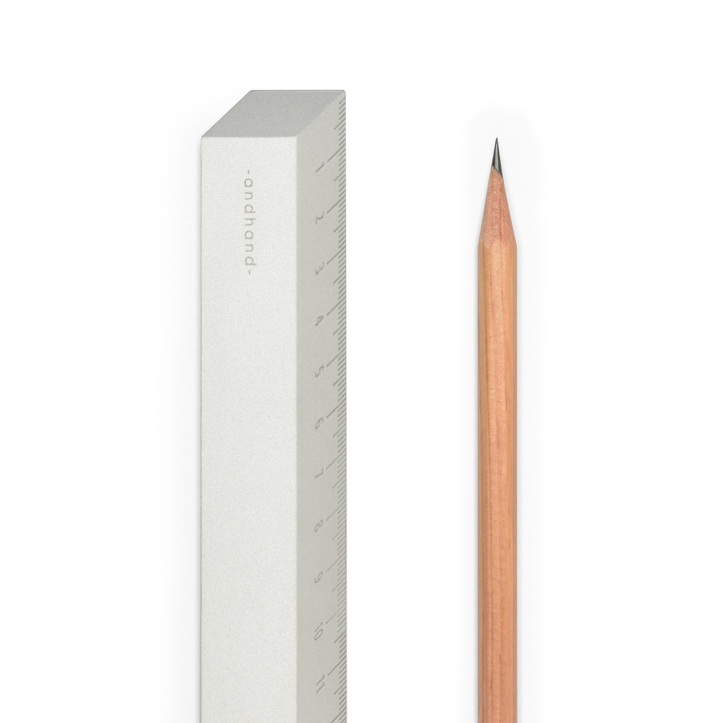 The illusion ruler by Andhand, modern and striking design. Its angled profile allows for extremely accurate mark making and measurements in both metric and imperial. Shown here in silver satin anodized finish.