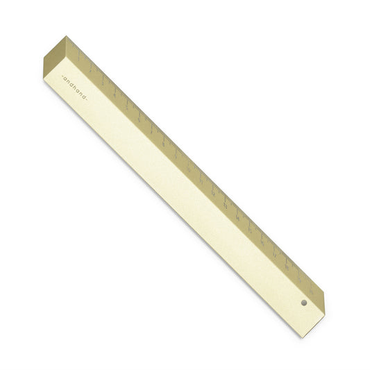 The illusion ruler by Andhand, modern and striking design. Its angled profile allows for extremely accurate mark making and measurements in both metric and imperial. Seen here in gold lustre satin anodized finish.