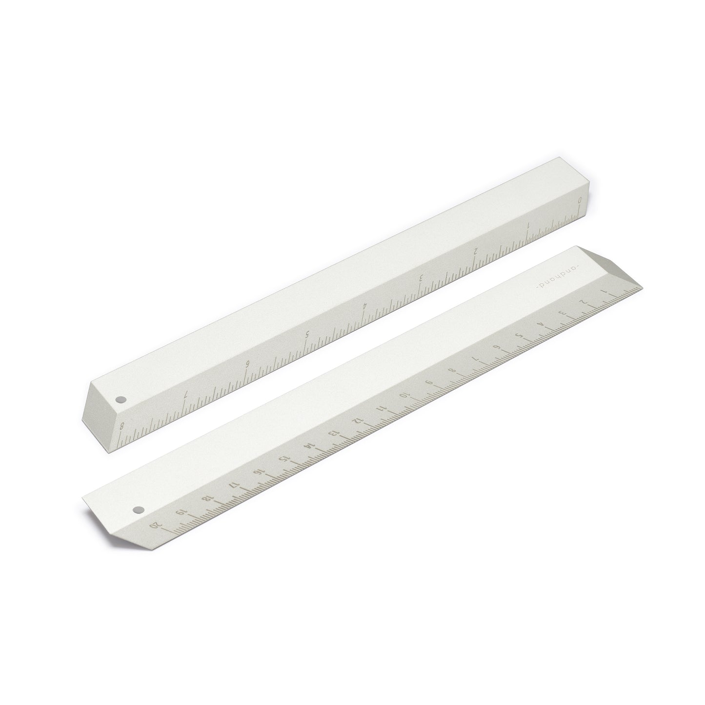 The illusion ruler by Andhand, modern and striking design. Its angled profile allows for extremely accurate mark making and measurements in both metric and imperial. Shown here in silver satin anodized finish.