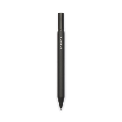 Solid aluminium & brass ballpoint black pen from Andhand. An expertly precise writing tool with a smooth mechanism and modern minimal design. Amazingly durable and refined. Shown here in black satin anodized finish.