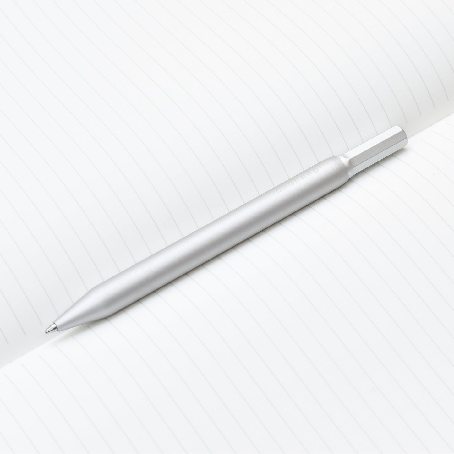 Solid aluminium & brass ballpoint pen from Andhand. An expertly precise writing tool with a smooth mechanism and modern minimal design. Amazingly durable and refined. Shown here in silver satin anodized finish.