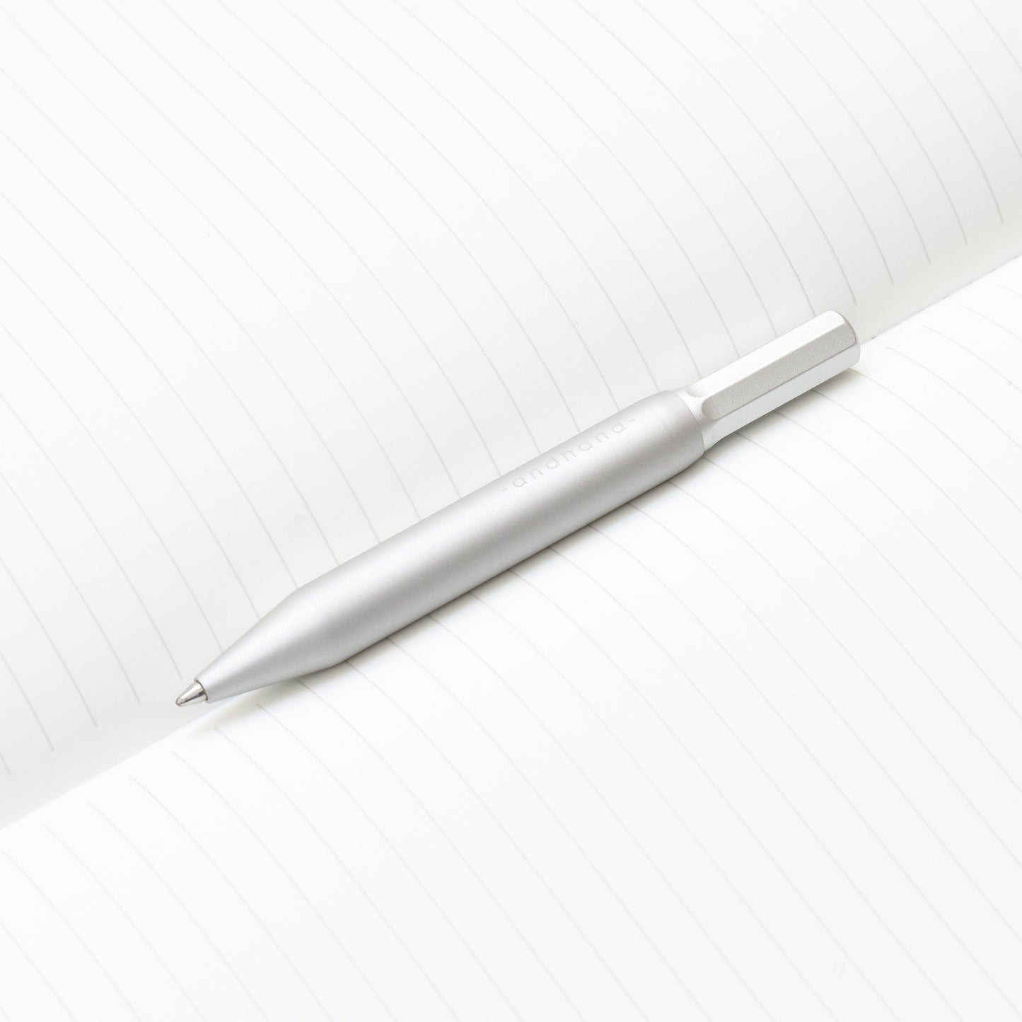 4 inch pen. Aluminium and brass everyday carry ballpoint pen from Andhand. An expert compact writing tool with a smooth mechanism and modern minimal design. Amazingly durable and refined. Shown here in silver lustre anodized finish.