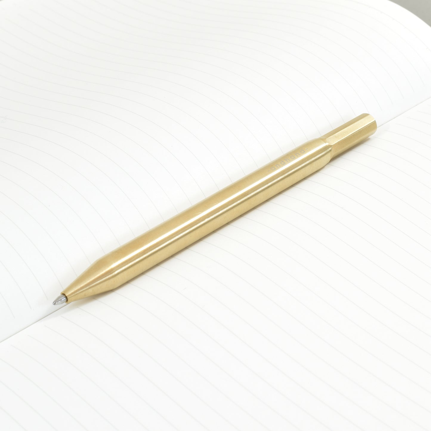 Solid brass ballpoint pen from Andhand. An expertly precise writing tool featuring a smooth mechanism and modern minimal design. Amazingly durable and refined.