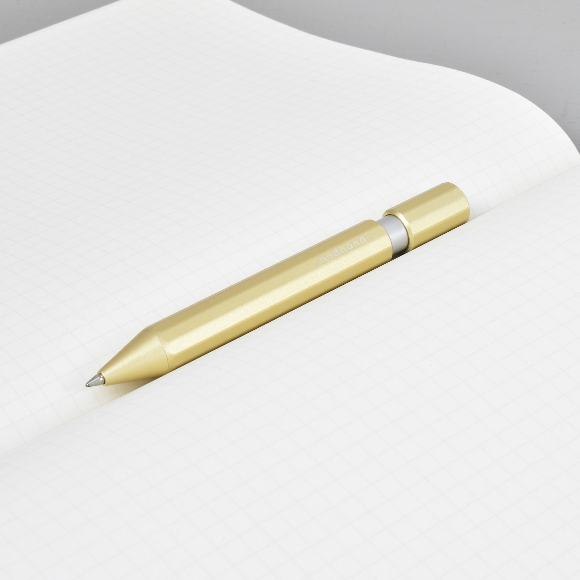 Aspect retractable pen in gold lustre anodized finish. A great pen for journaling, sketching or note taking. Equipped with a capless system rollerball cartridge for great ink flow.