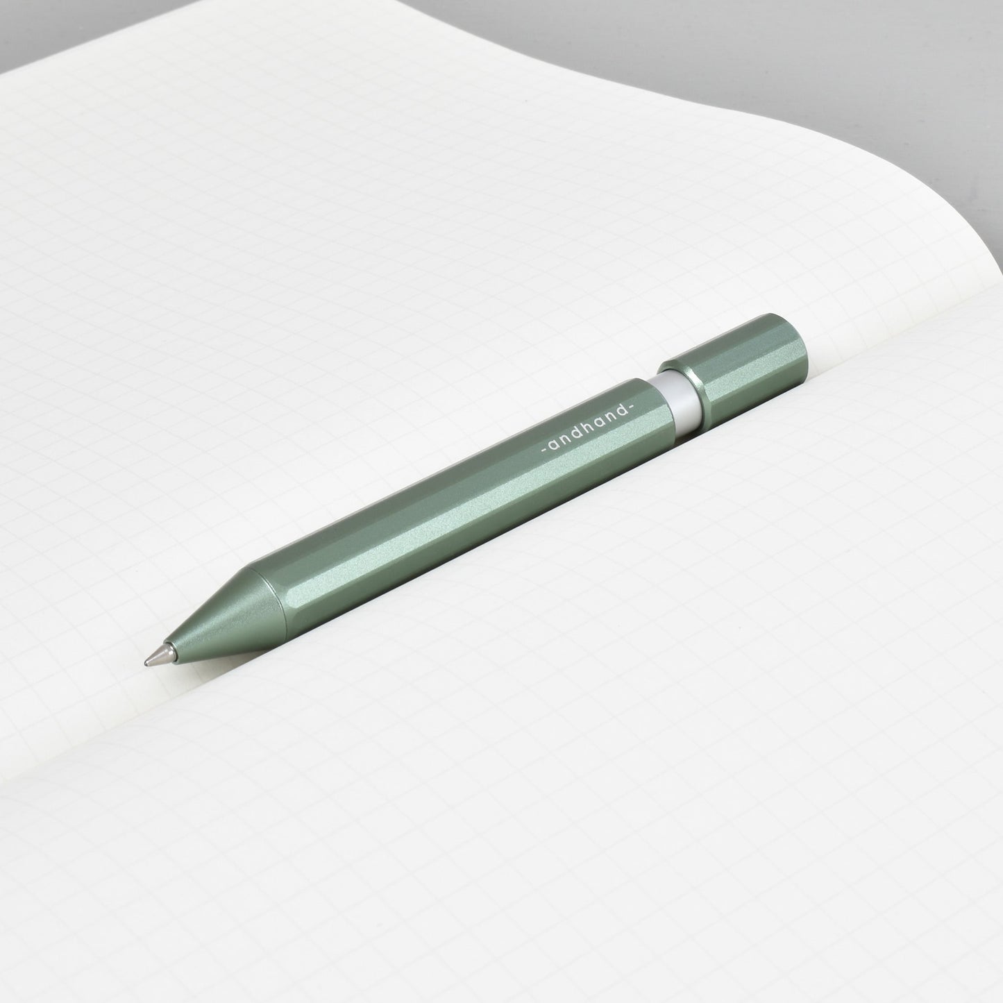 Aspect retractable pen in forest green anodized finish. A great pen for journaling, sketching or note taking. Equipped with a capless system rollerball cartridge for great ink flow.