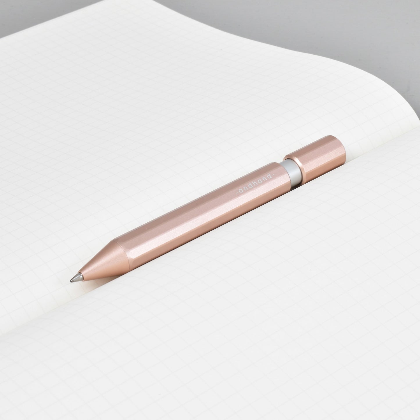 Aspect retractable pen in blush pink anodized finish. A great pen for journaling, sketching or note taking. Equipped with a capless system rollerball cartridge for great ink flow.