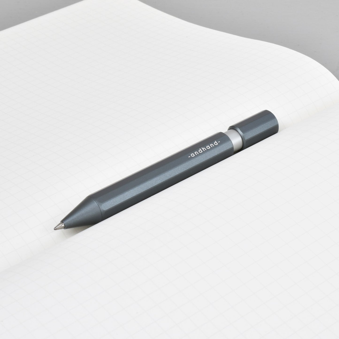 Aspect retractable pen in slate grey anodized finish. A great pen for journaling, sketching or note taking. Equipped with a capless system rollerball cartridge for great ink flow.