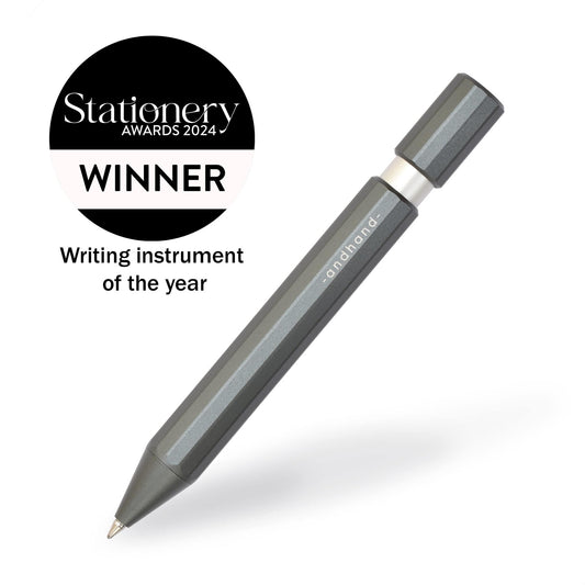 Aspect retractable pen in slate grey anodized finish. A great pen for journaling, sketching or note taking. Equipped with a capless system rollerball cartridge for great ink flow. Writing instrument of the year, stationery awards 2024.