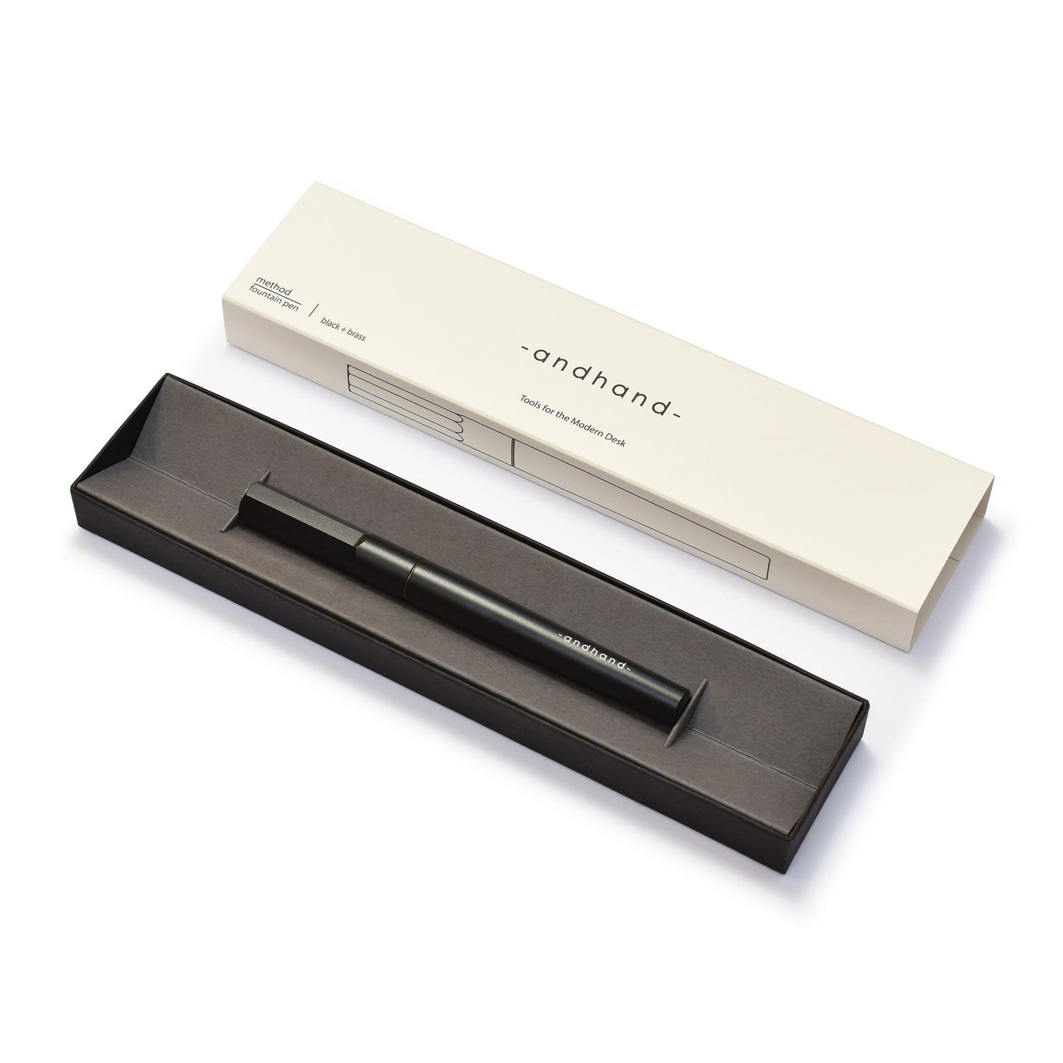 Andhand black and brass fountain pen, shown here with its crisp modern presentation box.