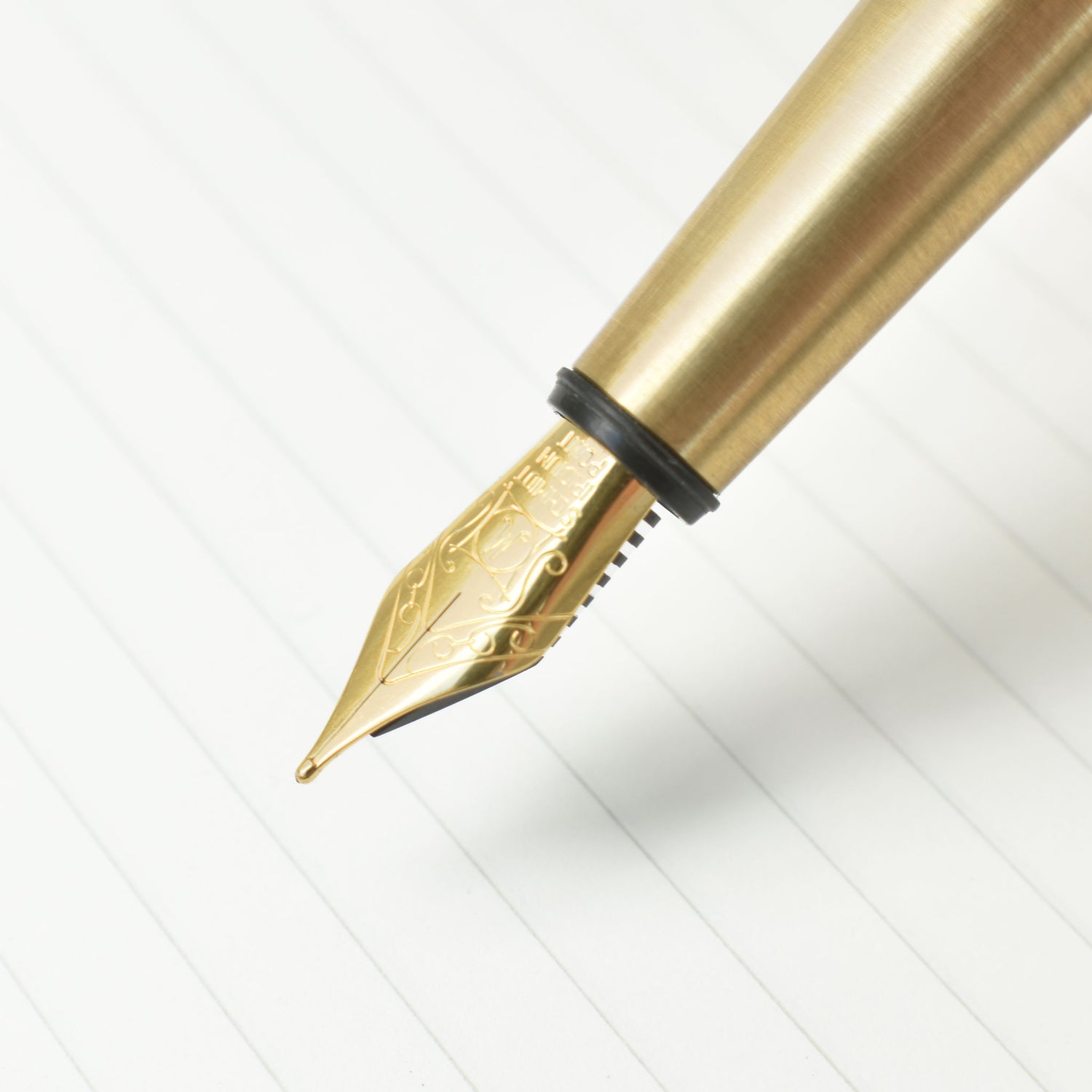 Close up image of the gold plated Schmidt medium nib. Method brass fountain pen. 