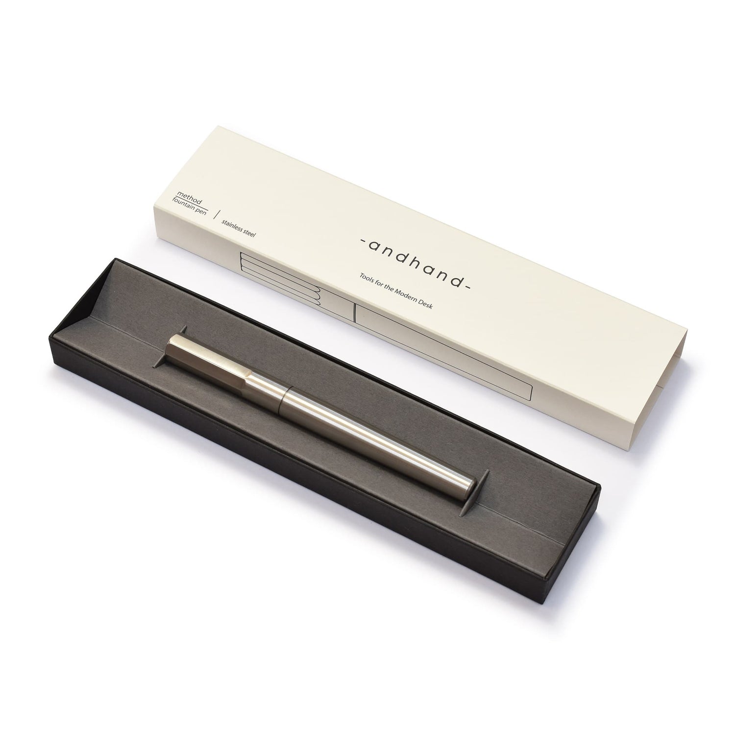 Stainless steel fountain pen. It comes in a premium card presentation box with minimal graphic sleeve.