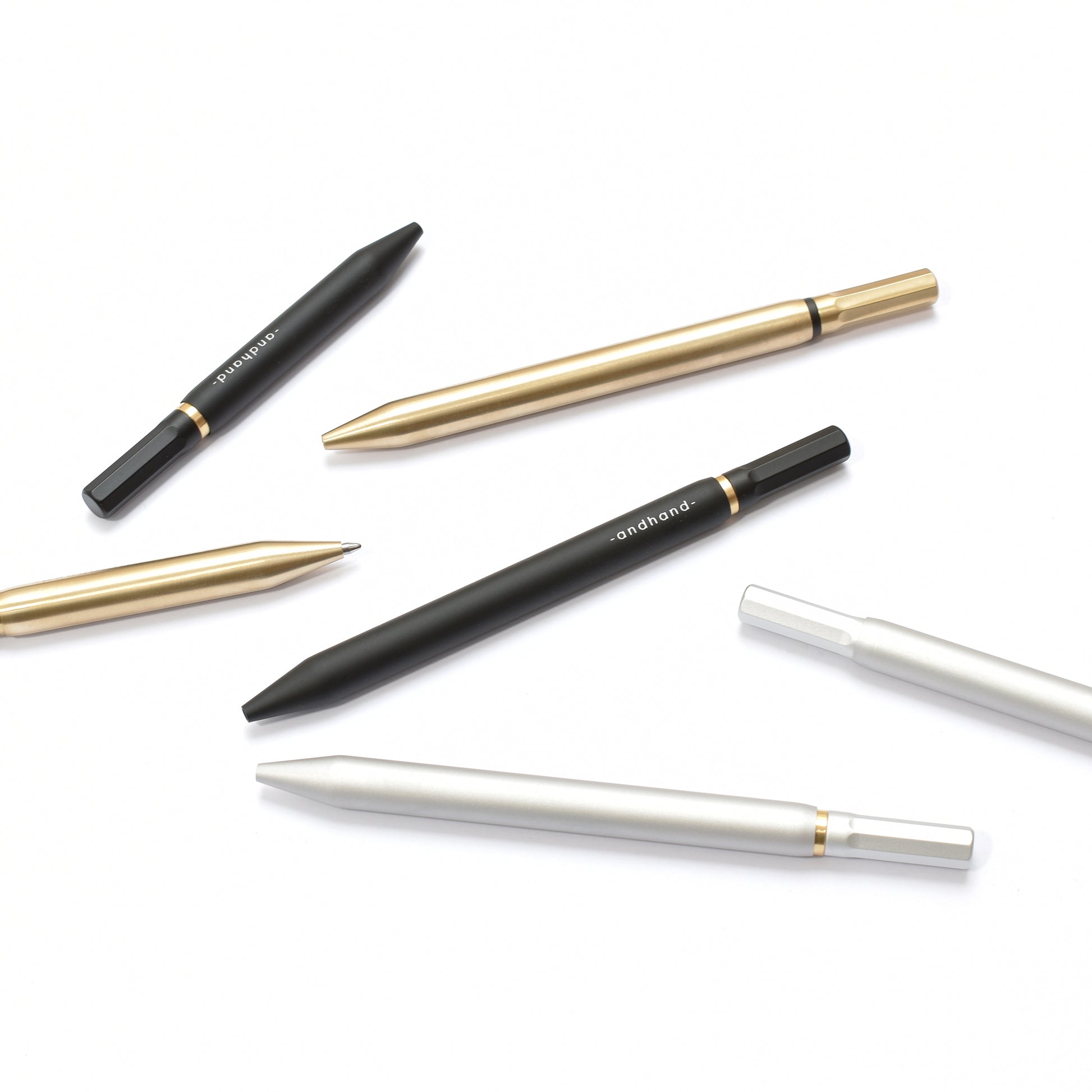 Aluminium and brass everyday carry ballpoint pen from Andhand. An expert compact writing tool with a smooth mechanism and modern minimal design. Amazingly durable and refined. Shown here in silver lustre anodized finish.