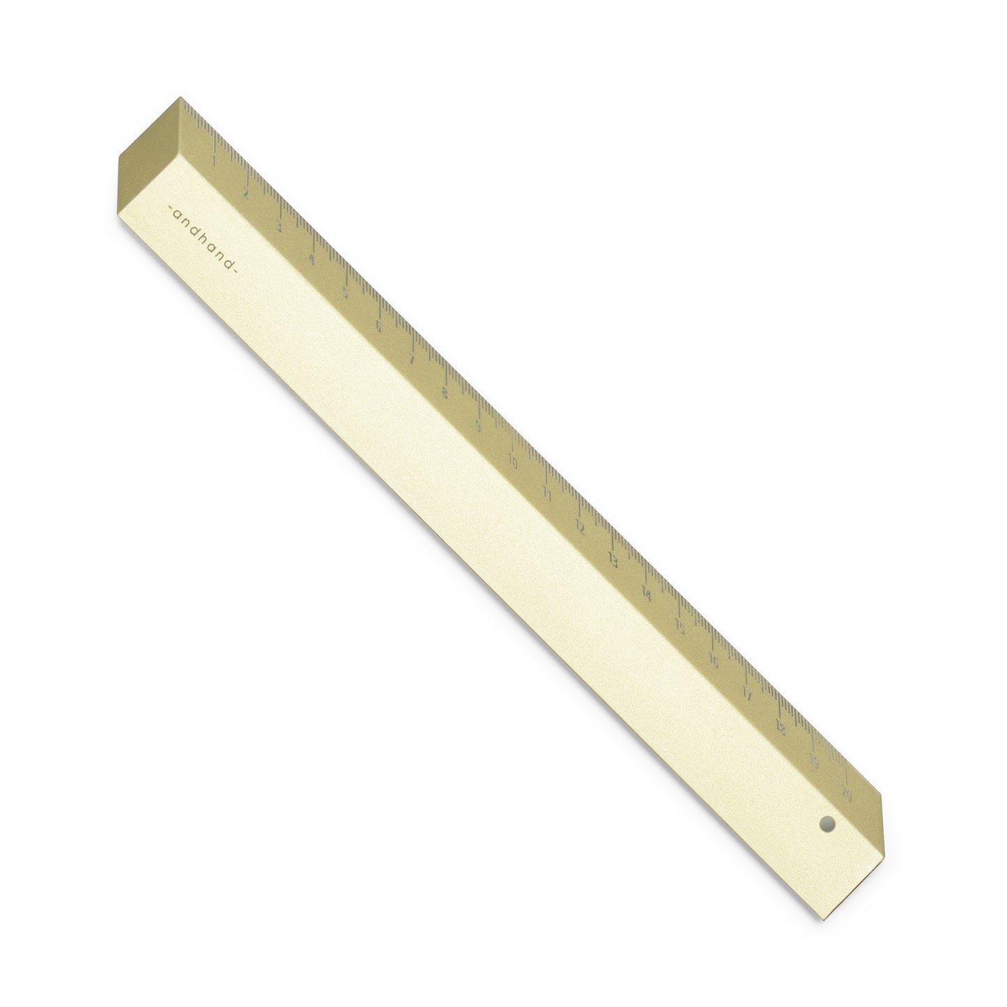 The illusion ruler by Andhand, modern and striking design. Its angled profile allows for extremely accurate mark making and measurements in both metric and imperial. Seen here in gold lustre satin anodized finish.