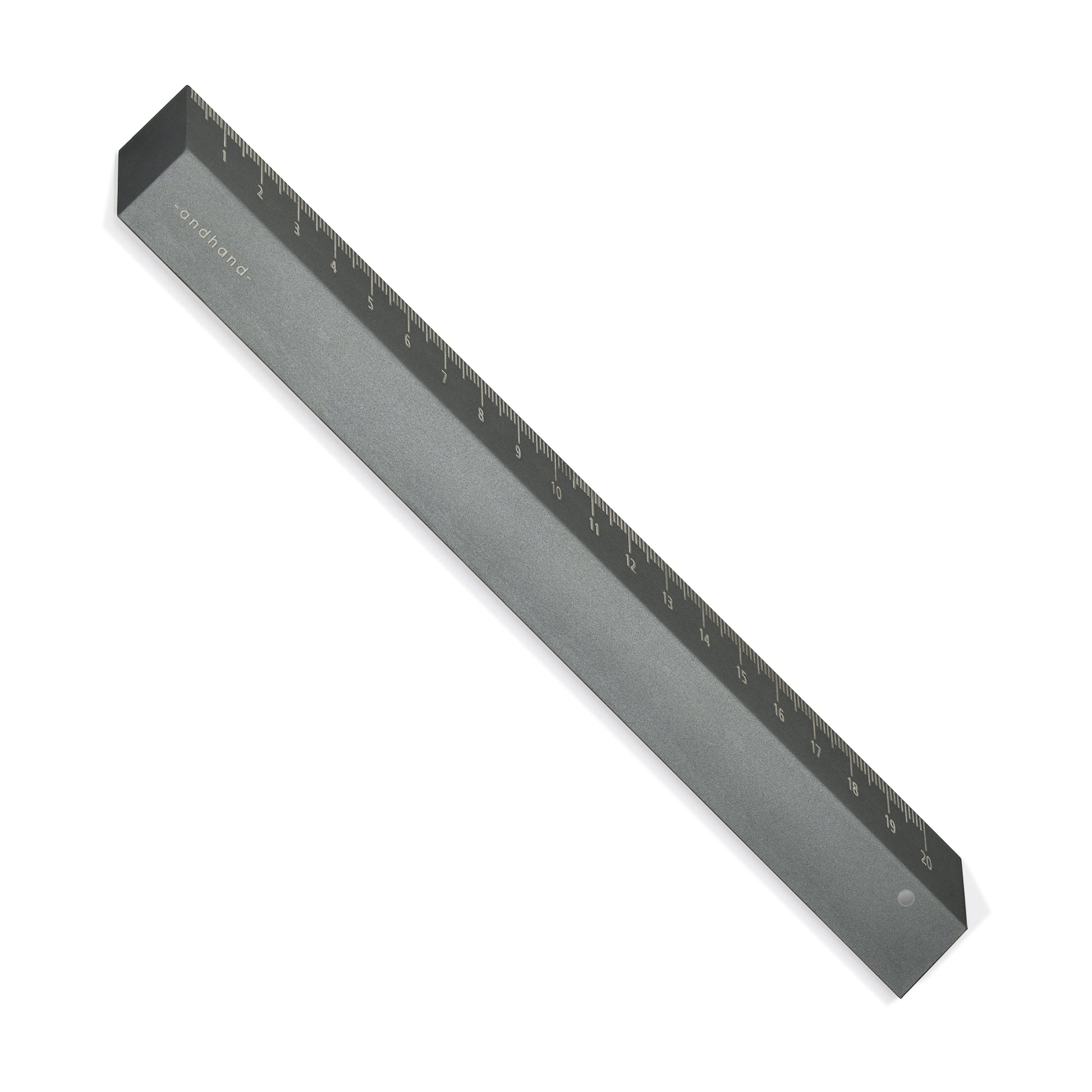 The illusion ruler by Andhand, modern and striking design. Its angled profile allows for extremely accurate mark making and measurements in both metric and imperial. Shown here in slate grey satin anodized finish.
