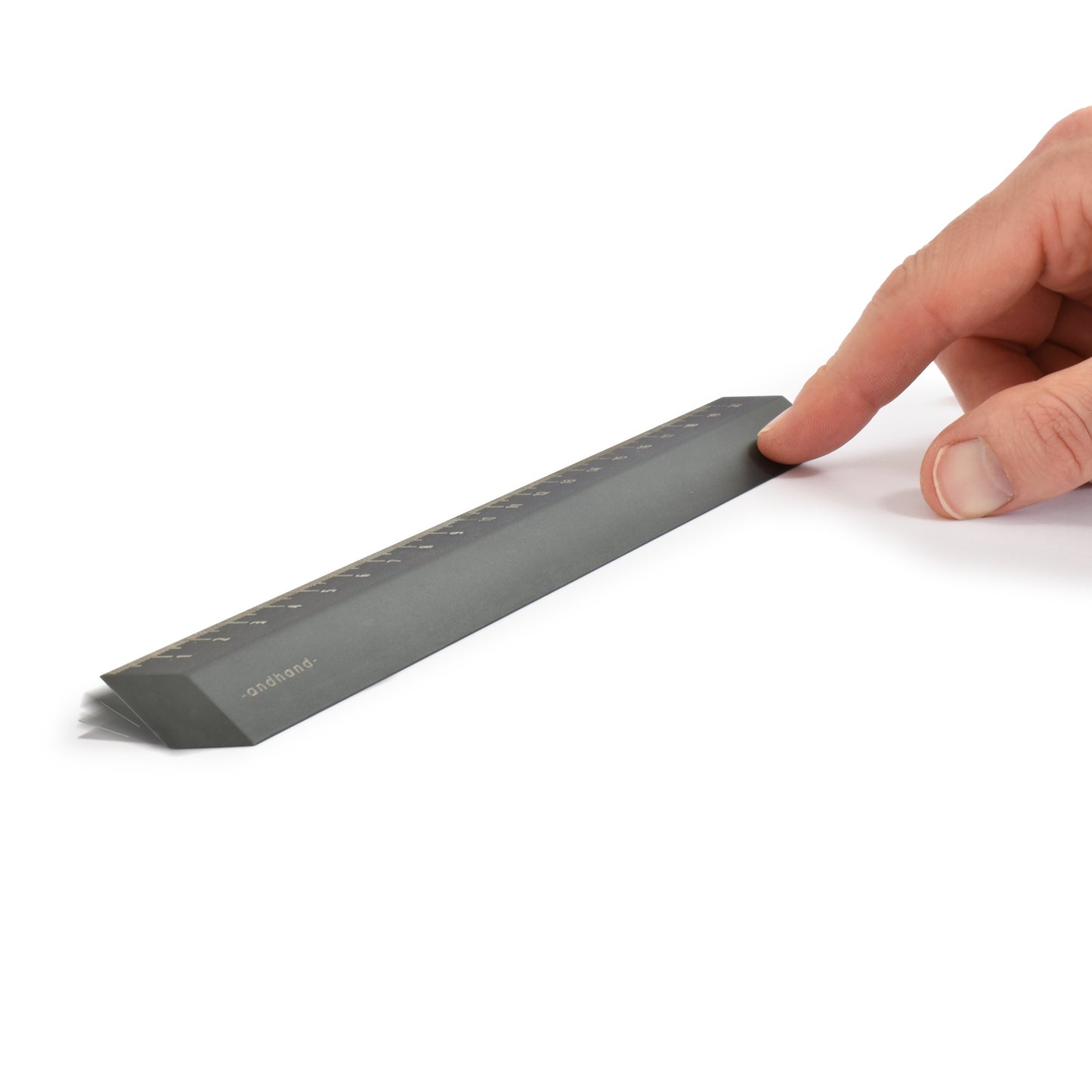 The illusion ruler by Andhand, modern and striking design. Its angled profile allows for extremely accurate mark making and measurements in both metric and imperial. Shown here in slate grey satin anodized finish.