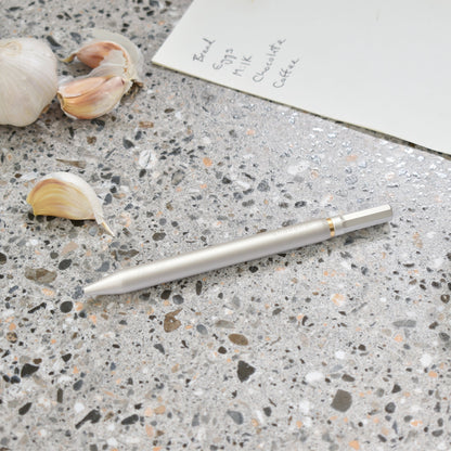 Solid aluminium & brass ballpoint pen from Andhand. An expertly precise writing tool with a smooth mechanism and modern minimal design. Amazingly durable and refined. Shown here in silver satin anodized finish.