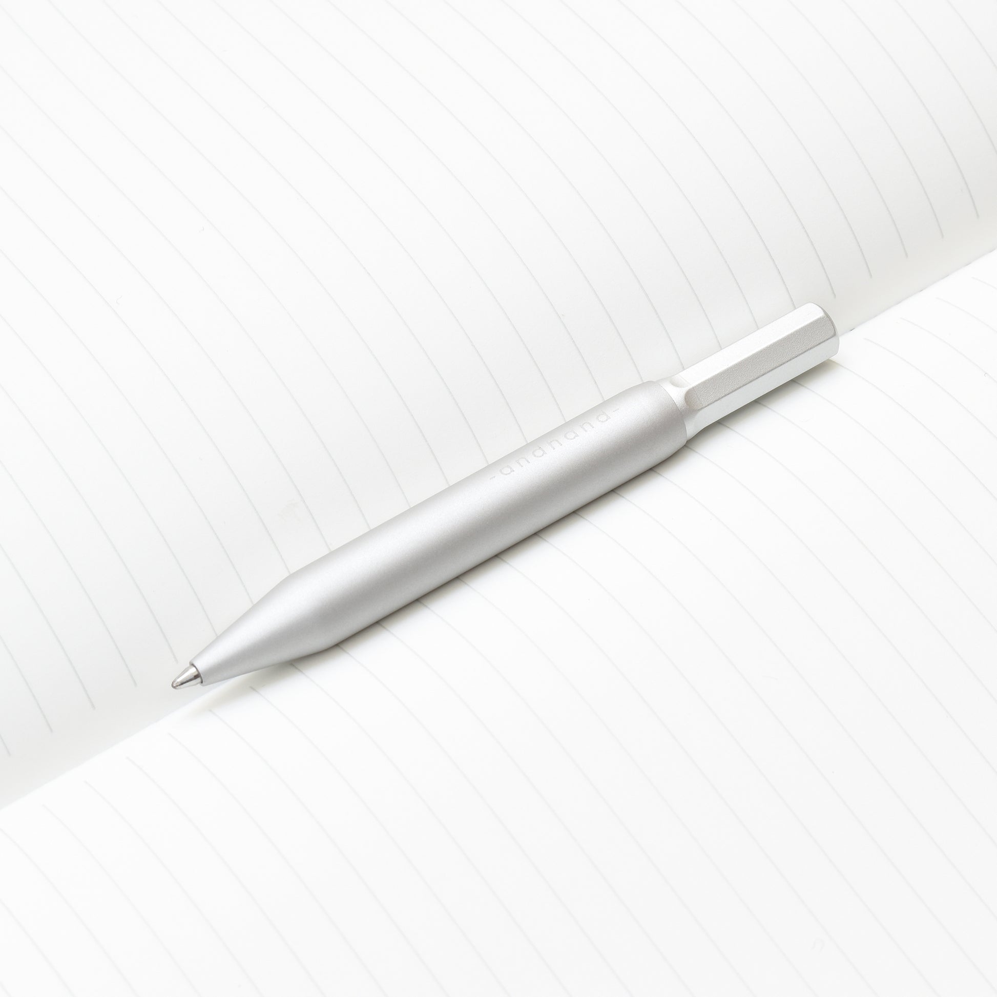 4 inch pen. Aluminium and brass everyday carry ballpoint pen from Andhand. An expert compact writing tool with a smooth mechanism and modern minimal design. Amazingly durable and refined. Shown here in silver lustre anodized finish.